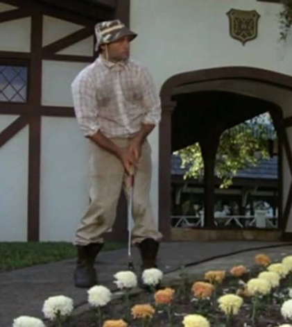 Carl Spackler, aka Bill Murray, swings at flowers in Caddyshack