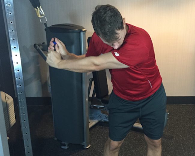 Jaacob Bowden performs a golf fitness exercise using resistance bands that you can use for more distance