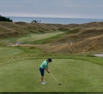 Jaacob Bowden tees off on #10 at Arcadia Bluffs - Bluffs Course towards Lake Michigan