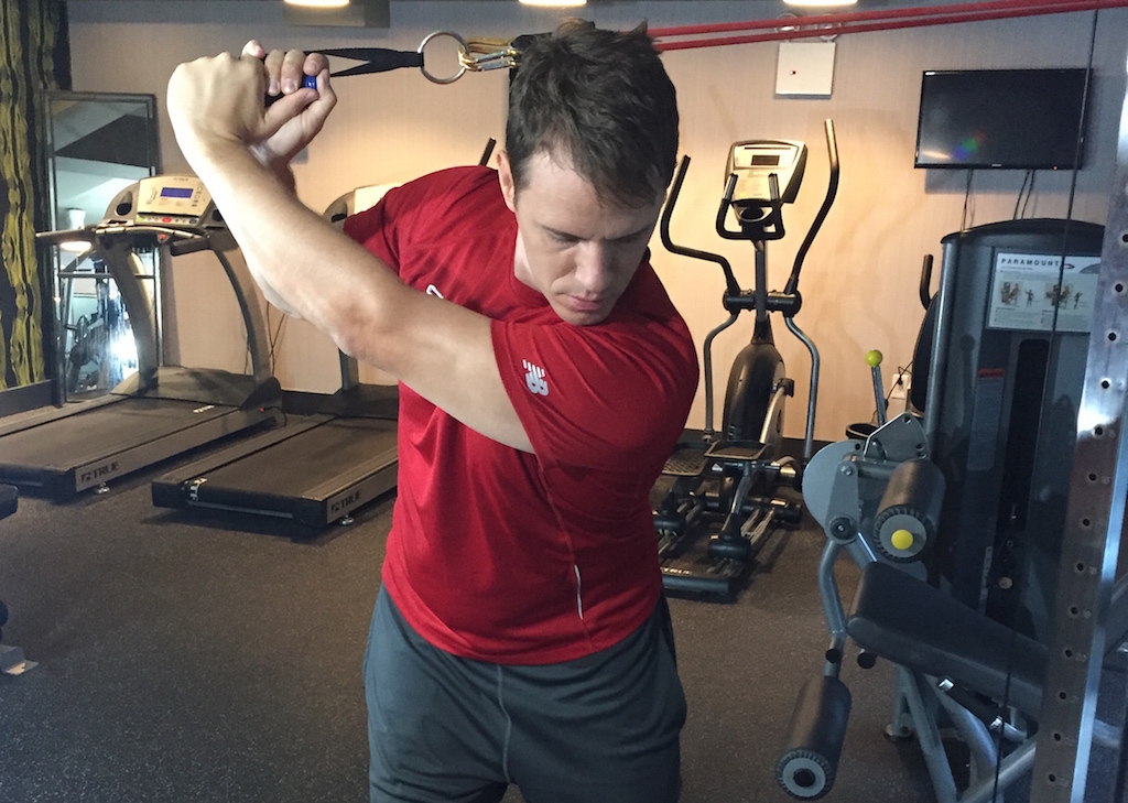 Jaacob Bowden demonstrates a downswing band isometric golf exercise to gain distance