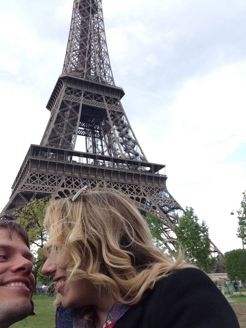 Jaacob Bowden & Jennifer Giroux lay next to the Eiffel Tower in 2013